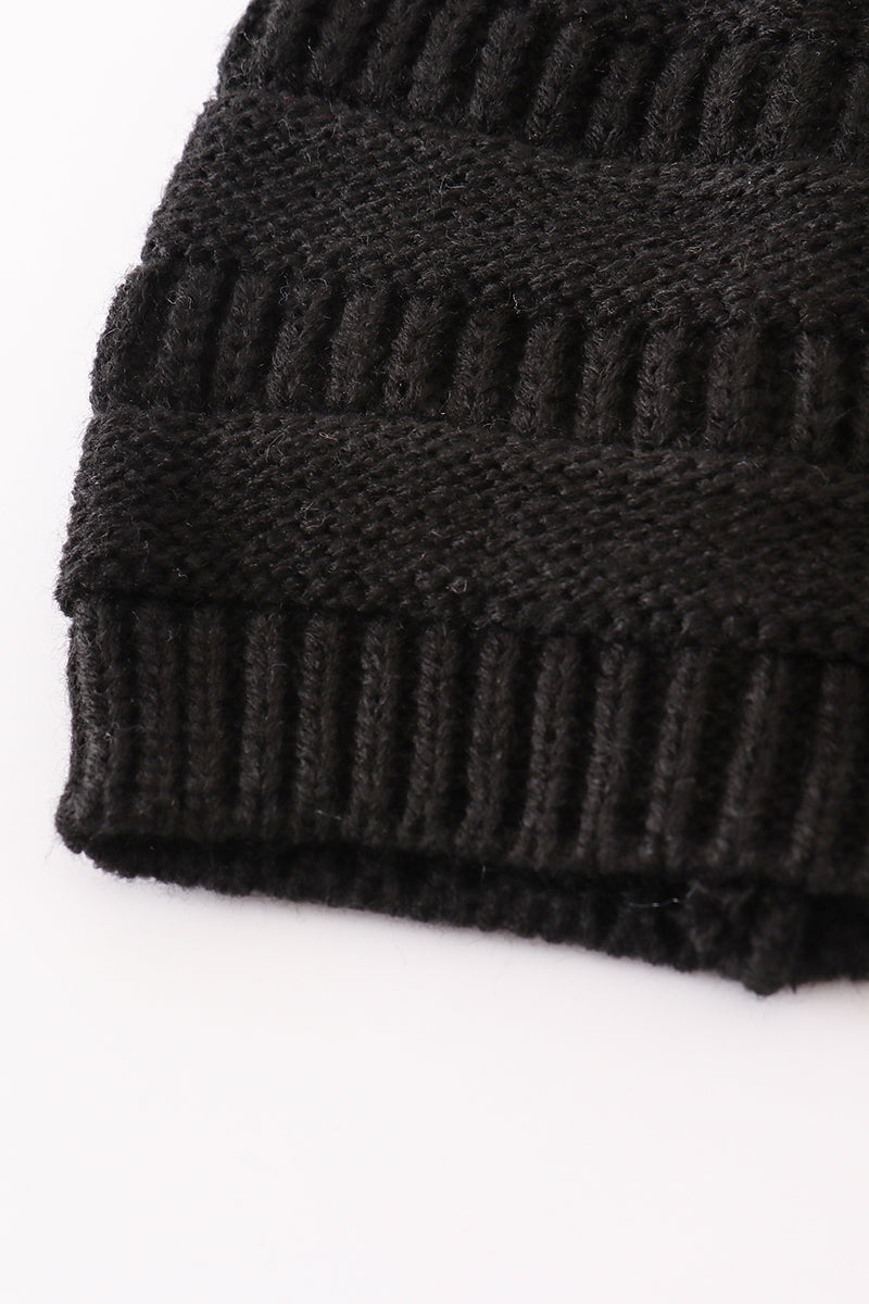 Black pompom cable beanie