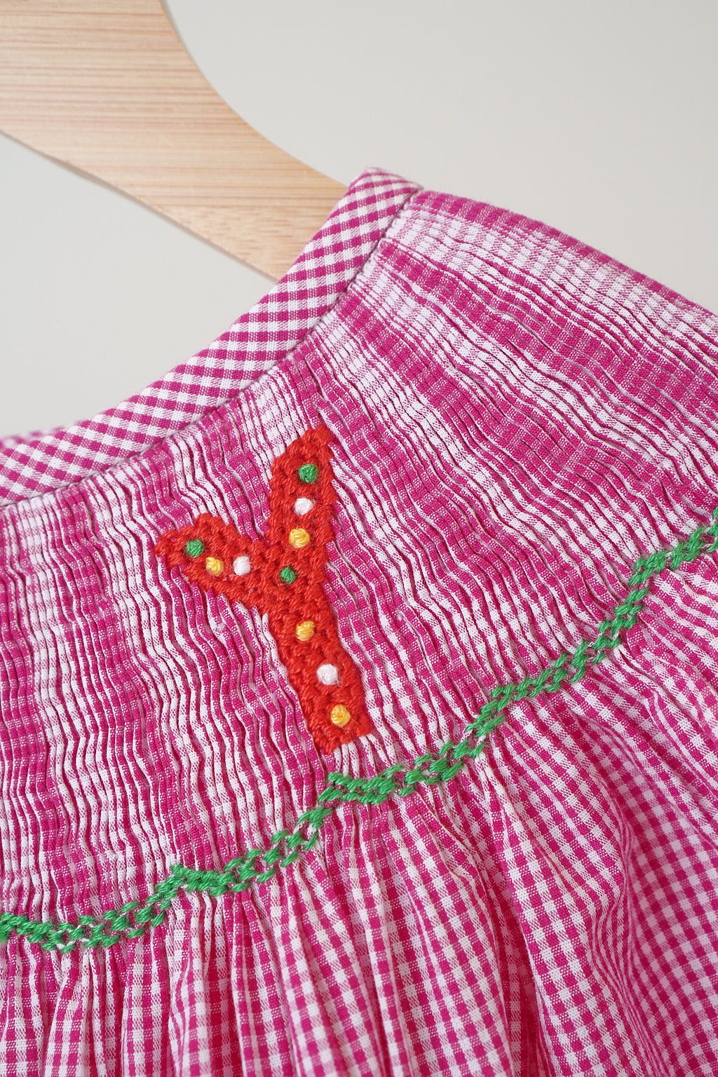 Pink christmas joy hand smocked gingham dress